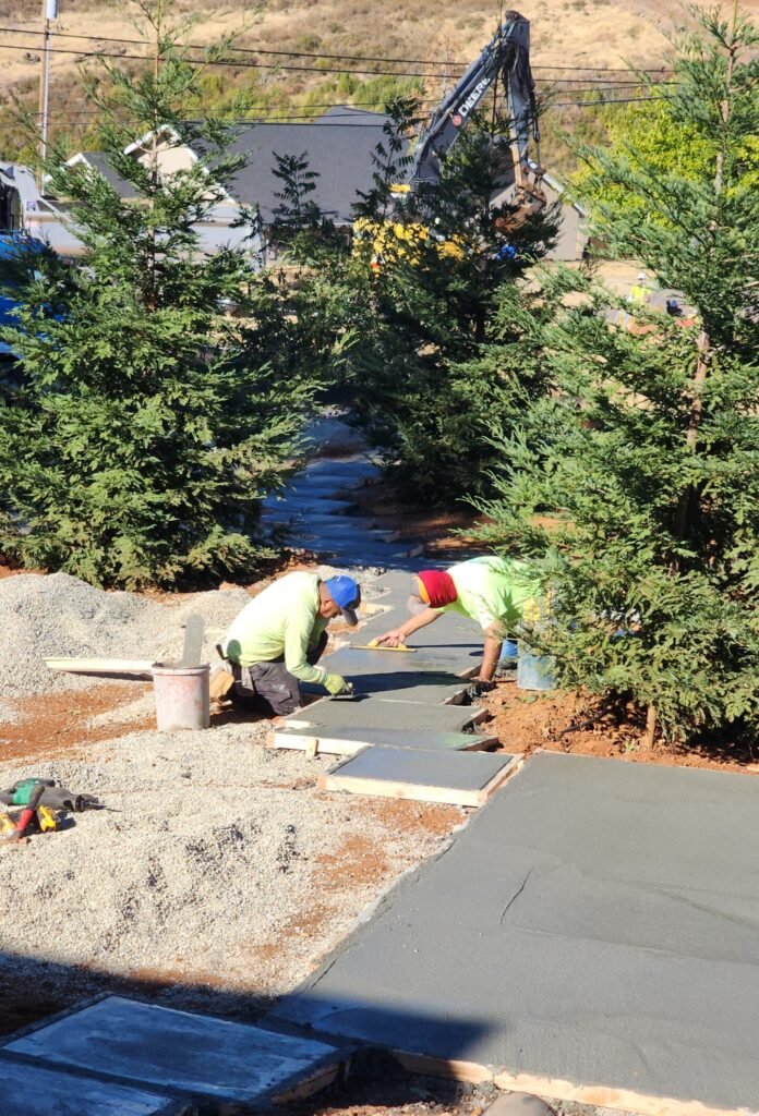 We designed and installed firepits, stone pads, steps, and boulders to create a stunning, weather-resistant outdoor space. Built to withstand rain and sun, this hardscaping adds both function and durability to the landscape.